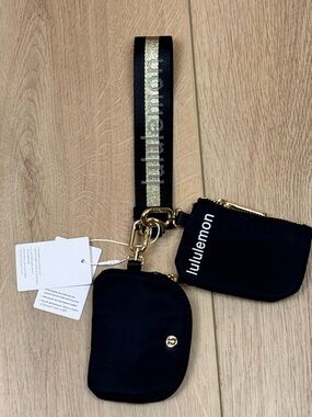 NWT Lululemon Dual Pouch Wristlet Black and Gold Wordmark